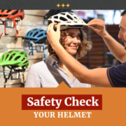 Woman buying helmet and checking the fit for safety