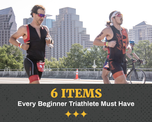 Two males run on South 1st Street bridge with the Austin skyline in the background during the CapTex Triathlon. Text in design reads 6 Items Every Beginner Triathlete Must Have. Learn more at https://captextri.com/6-items-beginner-triathlete/