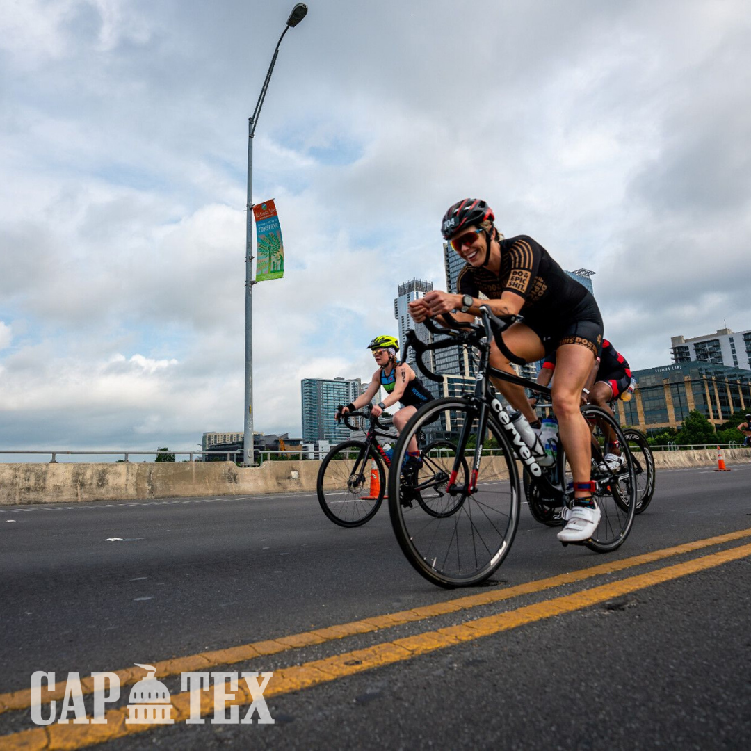 Cyclists cross the South 1st Street bridge during the CapTex Tri.