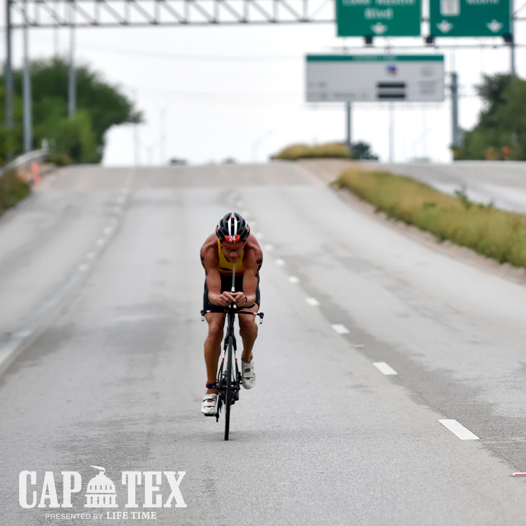 Cyclist rides on a stretch of Cesar Chavez Street during the CapTex Tri.