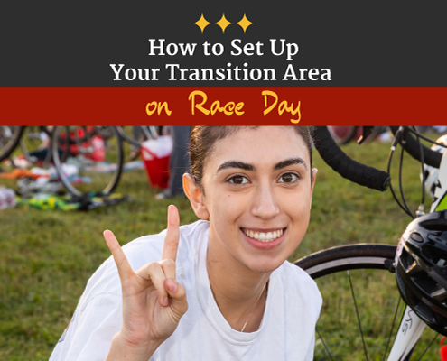 Triathlete makes the longhorn symbol with her right hand while setting up in transition race morning. Text on design reads How to Set Up Your Transition Area on Race Day. Read more at https://captextri.com/set-up-your-transition-area/